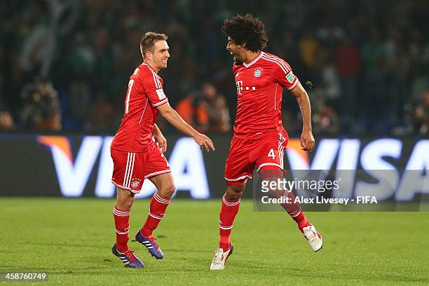 Dante of FC Bayern Munchen celebrates with Philipp Lahm after scoring the opening goal during the FIFA Club World Cup Final between FC Bayern Munchen...