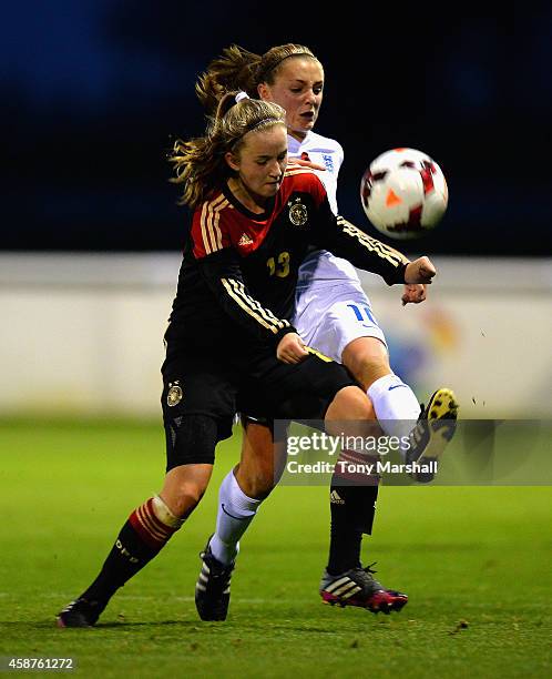 Alisa Pesteritz of Germany is tackled by Georgia Stanway of England during the International Friendly match between U16 Girl's England v U16 Girl's...
