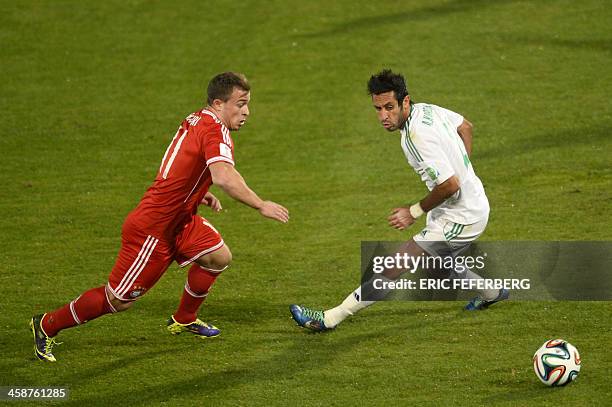 Bayern Munich's Swiss midfielder Xherdan Shaqiri fights for the ball against Morocco Raja Casablanca's defender Adil Karrouchy during their 2013 FIFA...