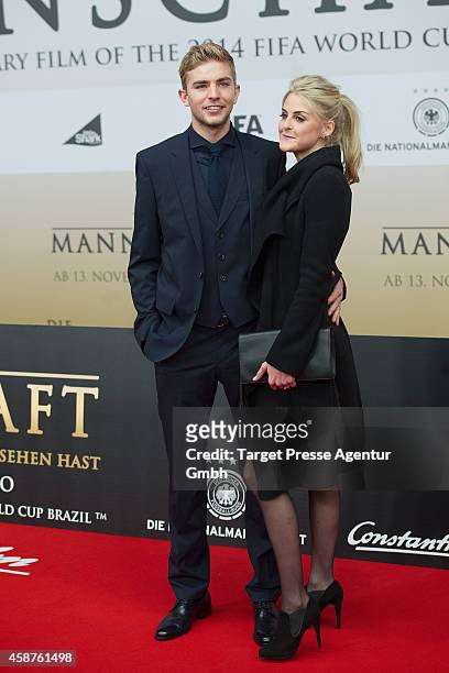 Christoph Kramer and his girlfriend Celina attend the 'Die Mannschaft' premiere at Potsdamer Platz on November 10, 2014 in Berlin, Germany.