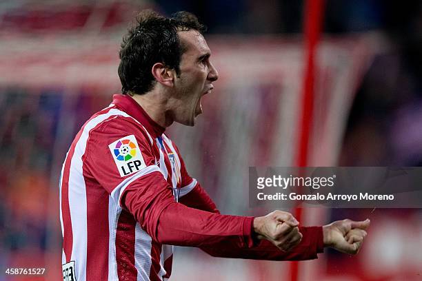 Diego Godin of Atletico de Madrid celebrates scoring their opening goal during the La Liga match between Club Atletico de Madrid and Levante UD at...