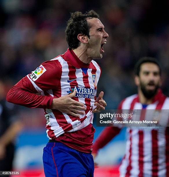 Diego Godin of Atletico de Madrid celebrates scoring their opening goal during the La Liga match between Club Atletico de Madrid and Levante UD at...