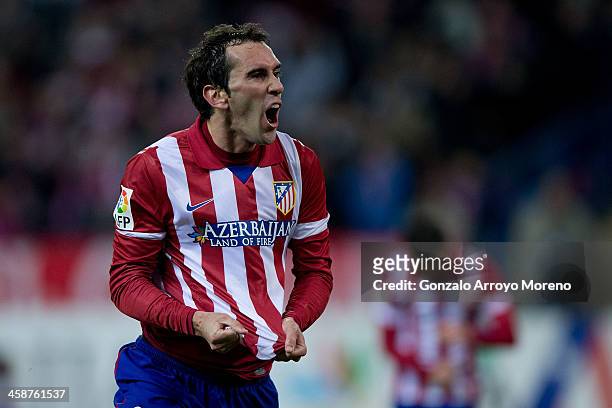 Diego Godin of Atletico de Madrid celebrates scoring their opening goal during the La Liga match between Club Atletico de Madrid and Levante UD at...