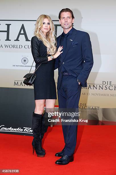 Lisa Rossenbach and Roman Weidenfeller attend the 'Die Mannschaft' Premiere at Sony Centre on November 10, 2014 in Berlin, Germany.