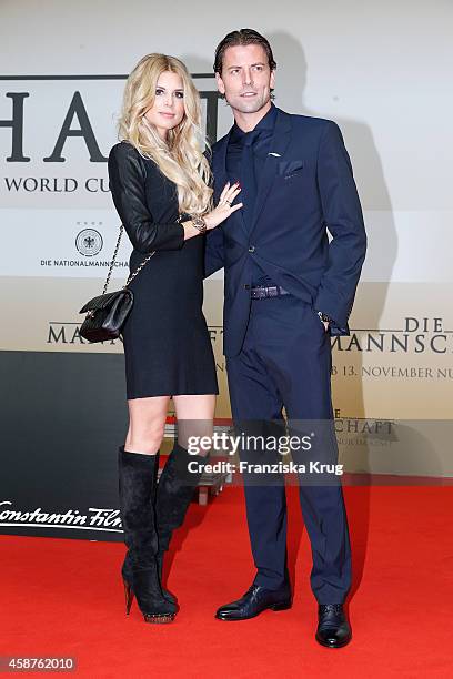 Lisa Rossenbach and Roman Weidenfeller attend the 'Die Mannschaft' Premiere at Sony Centre on November 10, 2014 in Berlin, Germany.