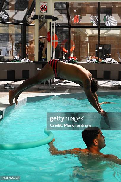 Sam Thaiday dives into the pool during an Australian Kangaroos recovery session at InterContinental Hotel Wellington on November 11, 2014 in...