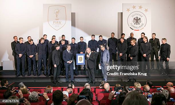 The German natioal football team, Joachim Loew, Wolfgang Niersbach and Joseph Blatter attend the 'Die Mannschaft' Premiere at Sony Centre on November...