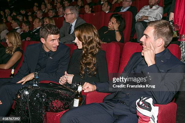 Thomas Mueller, Lisa Mueller and Philipp Lahm attend the 'Die Mannschaft' Premiere at Sony Centre on November 10, 2014 in Berlin, Germany.