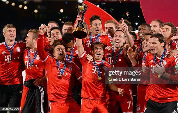 Philipp Lahm of Muenchen lifts the trophy after winning the FIFA Club World Cup Final between FC Bayern Muenchen and Raja Casablanca at Marrakech...