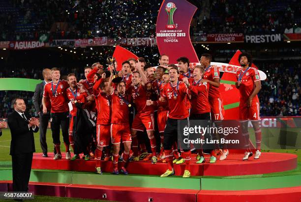 Philipp Lahm of Muenchen lifts the trophy after winning the FIFA Club World Cup Final between FC Bayern Muenchen and Raja Casablanca at Marrakech...