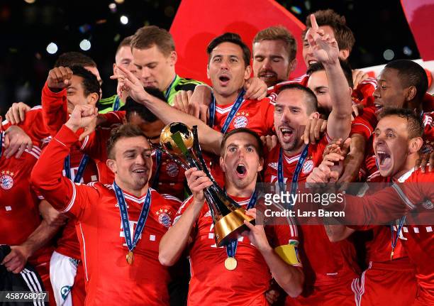 Philipp Lahm of Muenchen lifts the trophy after winning the FIFA Club World Cup Final between FC Bayern Muenchen and Raja Casablanca at Marrakech...