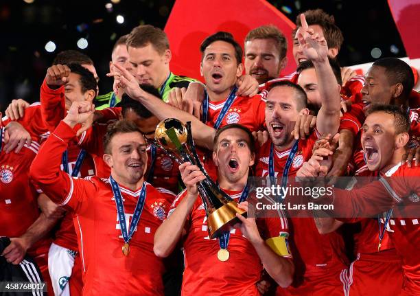 Philipp Lahm of Muenchen lifts the trophy after winning the FIFA Club World Cup Final between FC Bayern Muenchen and Raja Casablanca at Marrakech...