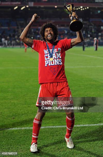 Dante of Bayern Muenchen celebrates with the trophy following the FIFA Club World Cup Final match between Bayern Muenchen and Raja Casablanca at...