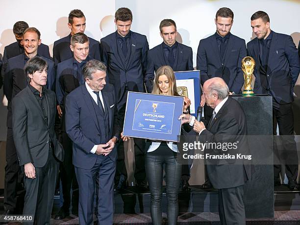 The German National Football Team, Joachim Loew, Wolfgang Niersbach and Joseph Blatter attend the 'Die Mannschaft' Premiere at Sony Centre on...