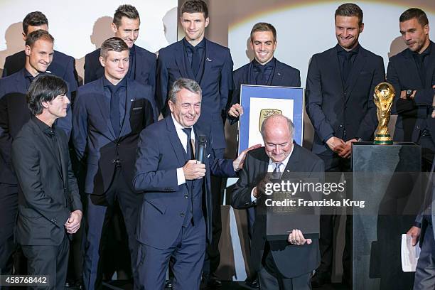 The German National Football Team, Joachim Loew, Wolfgang Niersbach and Joseph Blatter attend the 'Die Mannschaft' Premiere at Sony Centre on...