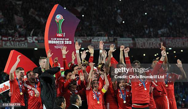 Philipp Lahm of Bayern Muenchen lifts the trophy following the FIFA Club World Cup Final match between Bayern Muenchen and Raja Casablanca at...