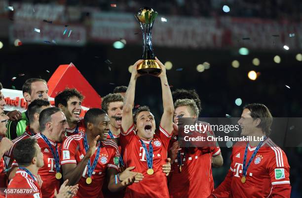 Rafinha of Bayern Muenchen lifts the trophy following the FIFA Club World Cup Final match between Bayern Muenchen and Raja Casablanca at Marrakech...