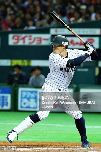 Outfielder Yoshio Itoi of Samurai Japan bats during the friendly match between Samurai Japan and Fukuoka SoftBank Hawks & Hokkaido Nipponham Fighters...