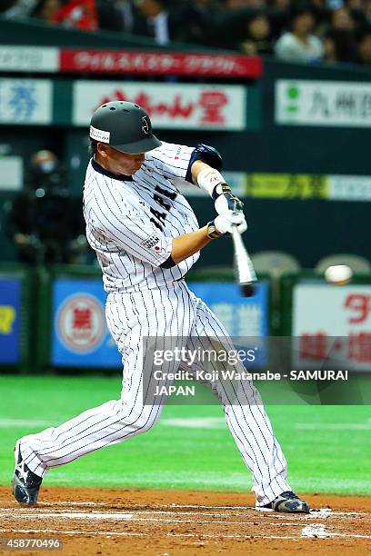 Catcher Motohiro Shima of Samurai Japan bats dring the friendly match between Samurai Japan and Fukuoka SoftBank Hawks & Hokkaido Nipponham Fighters...