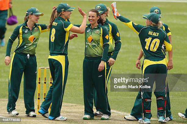 Erin Osbourne of Australia celebrates with her team after taking a wicket during game one of the women's One Day International series between...