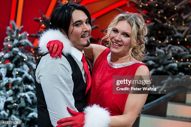 Winners Erich Klann and Magdalena Brzeska embrace after the Final of 'Let's Dance - Let's Christmas' TV Show on December 21, 2013 in Cologne, Germany.