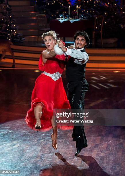 Magdalena Brzeska and Erich Klann perform during the Final of 'Let's Dance - Let's Christmas' TV Show on December 21, 2013 in Cologne, Germany.