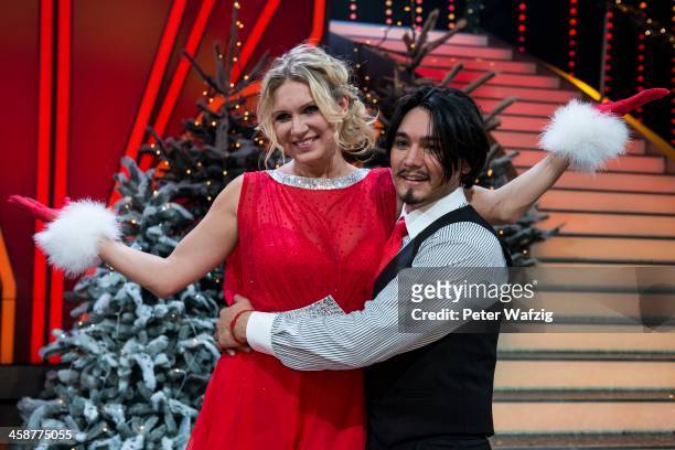 Winners Erich Klann and Magdalena Brzeska pose after the Final of 'Let's Dance - Let's Christmas' TV Show on December 21, 2013 in Cologne, Germany.