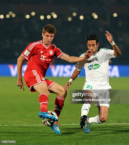 Thomas Mueller of Bayern Muenchen in action with Adil Karrouchy of Raja Casablanca during the FIFA Club World Cup Final match between Bayern Muenchen...