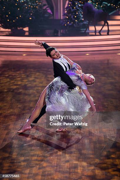 Magdalena Brzeska and Erich Klann perform during the Final of 'Let's Dance - Let's Christmas' TV Show on December 21, 2013 in Cologne, Germany.