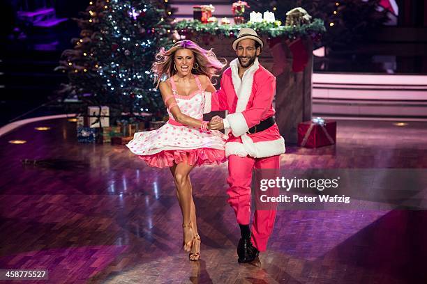 Sophia Thomalla and Massimo Sinato perform during the Final of 'Let's Dance - Let's Christmas' TV Show on December 21, 2013 in Cologne, Germany.