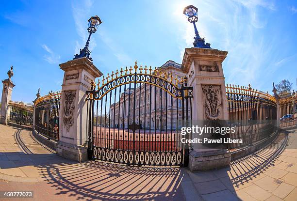 ornate gates to the buckingham palace in london - buckingham palace gates stock pictures, royalty-free photos & images