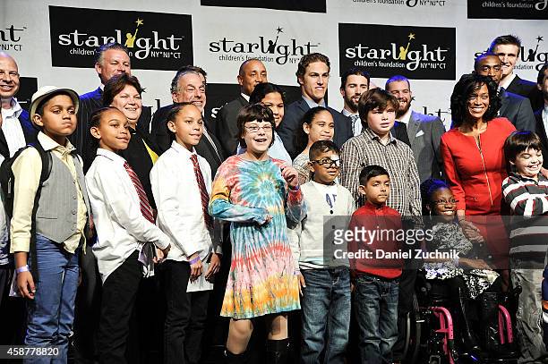 The honorees and attendees pose at the Starlight Children's Foundation 25th Annual Sports Auction at Hard Rock Cafe - Times Square on November 10,...