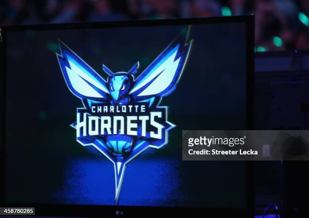 The Charlotte Bobcats unveil the new logo for next years team name change during their game at Time Warner Cable Arena on December 21, 2013 in...