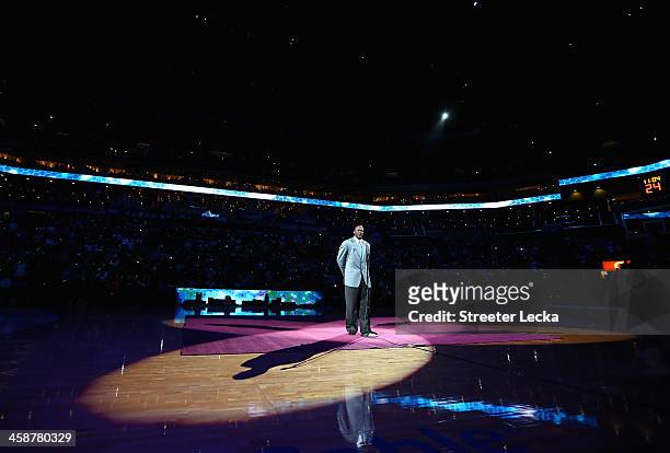 Team owner, Michael Jordan, of the Charlotte Bobcats unveils the new logo for next years name change during their game at Time Warner Cable Arena on...