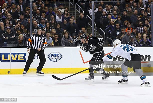 Tyler Toffoli of the Los Angeles Kings gets his shot off from the right wing before defenseman Dan Boyle of the San Jose Sharks can break up the play...