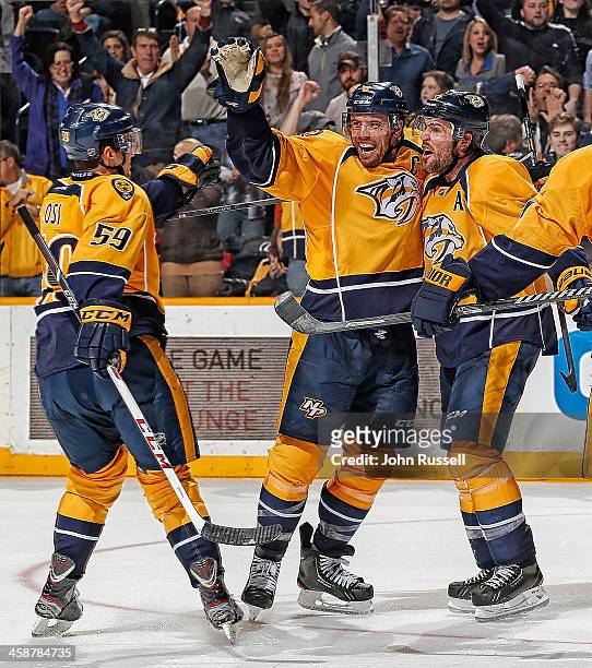 Shea Weber celebrates his goal with Roman Josi and Mike Fisher of the Nashville Predators against the Montreal Canadiens at Bridgestone Arena on...