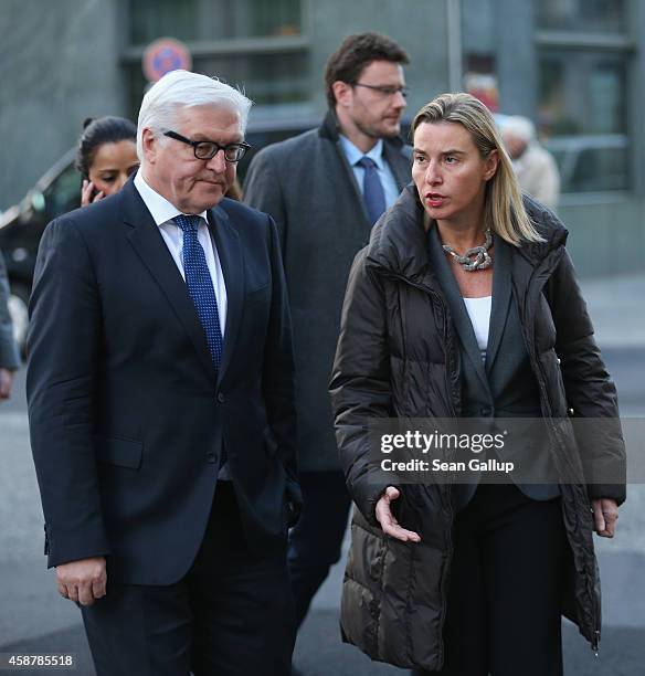 German Foreign Minister Frank-Walter Steinmeier and High Representative of the European Union for Foreign Affairs Federica Mogherini walk to an event...