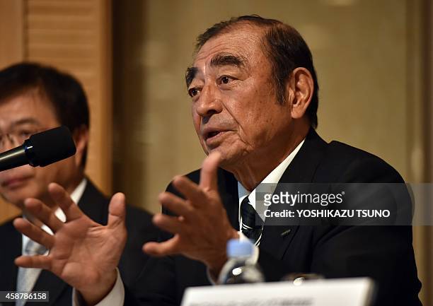Japan's Fujifilm Holdings chairman and CEO Shigetaka Komori announces the company's three-year business strategy in Tokyo on November 11, 2014 as the...