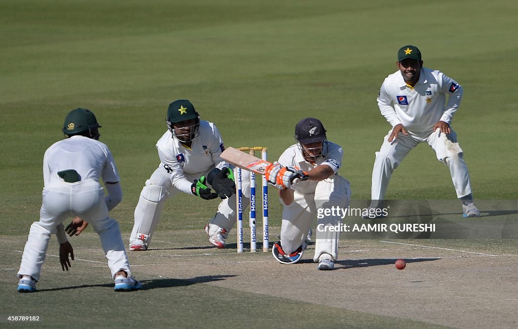 Pakistanibj New Zealand batsman BJ Watling plays a shot as Pakistani wicketkeeper ...