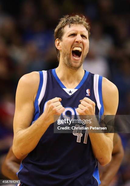 Dirk Nowitzki of the Dallas Mavericks reacts after scoring against the Phoenix Suns during the second half of the NBA game at US Airways Center on...