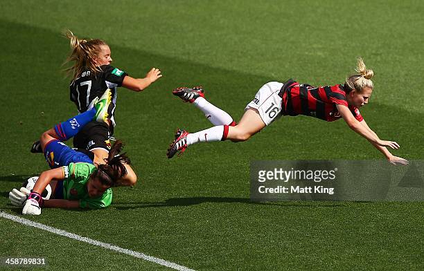 Linda O'Neill of the Wanderers collides with Lauren Brown of the Jets and Jets goalkeeper Eliza Campbell during the round six A-League match between...