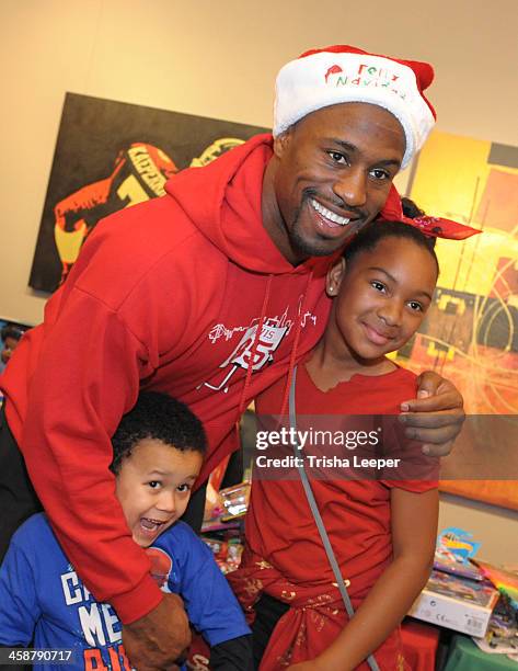 Vernon Davis hosts The Vernon Davis Foundation For The Arts Christmas Toy Give Away at Vernon Davis Art Gallery on December 21, 2013 in San Jose,...