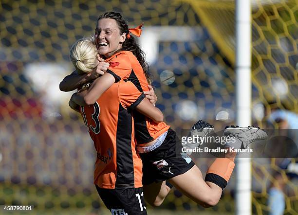 Hayley Raso of the Roar celebrates with Tameka Butt after scoring a goal during the round six W-League match between the Brisbane Roar and Sydney FC...
