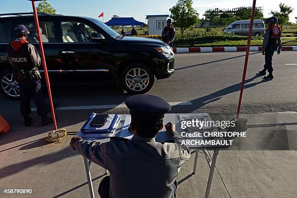 Policemen check vehicles at a check-point on a road leading to the venue of the upcoming ASEAN Summit at the Myanmar International Convention Center...