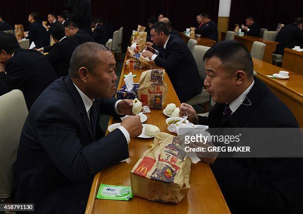Staff at the Zhongnanhai leadership compound eat a mixture of McDonalds and dumplings, while US President Barack Obama has a private dinner with...