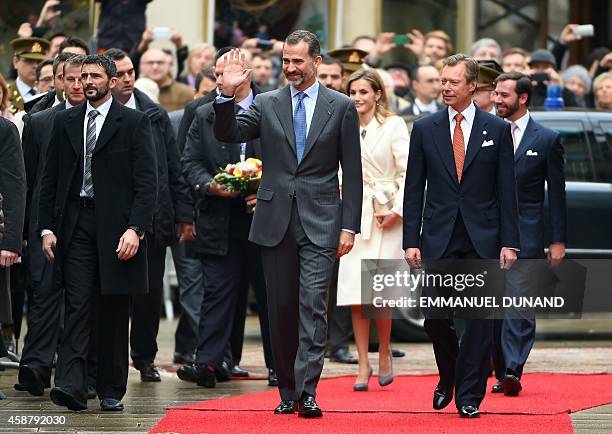 Spain's King Felipe VI and his wife Spanish Queen Letizia are welcomed by Grand Duke Henri of Luxembourg during an official welcoming ceremony at the...