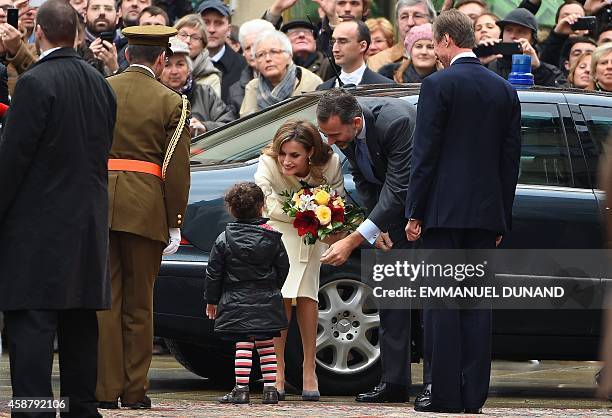 Spanish Queen Letizia receives flowers a young girl as she is welcomed with her husband Spanish King Felipe VI by Grand Duke Henri of Luxembourg ,...