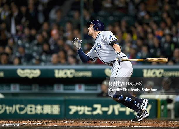 Evan Longoria of Tampa Bay Rays hits a grand slam in the top of 5th inning during the friendly match between Yomiuri Giants & Hanshin Tigers and MLB...
