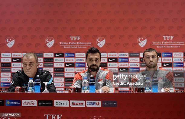 Turkey's national football team head coach Fatih Terim and his players Bekir Irtegun and Burak Yilmaz attend a press conference at the Hasan Dogan...