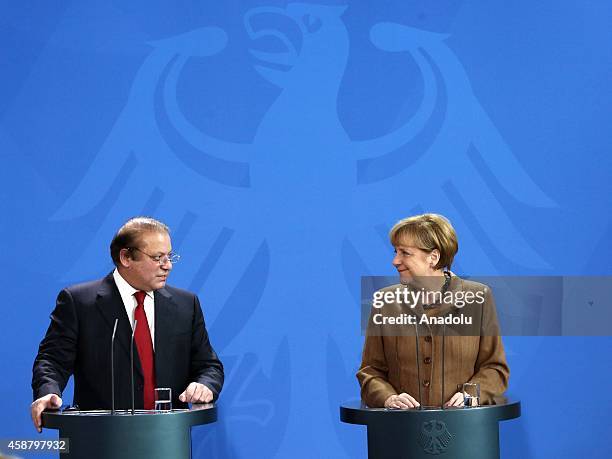 Germany's Chancellor Angela Merkel and Pakistan's Prime Minister Nawaz Sharif hold a joint press release after their meeting at the Prime Ministry...